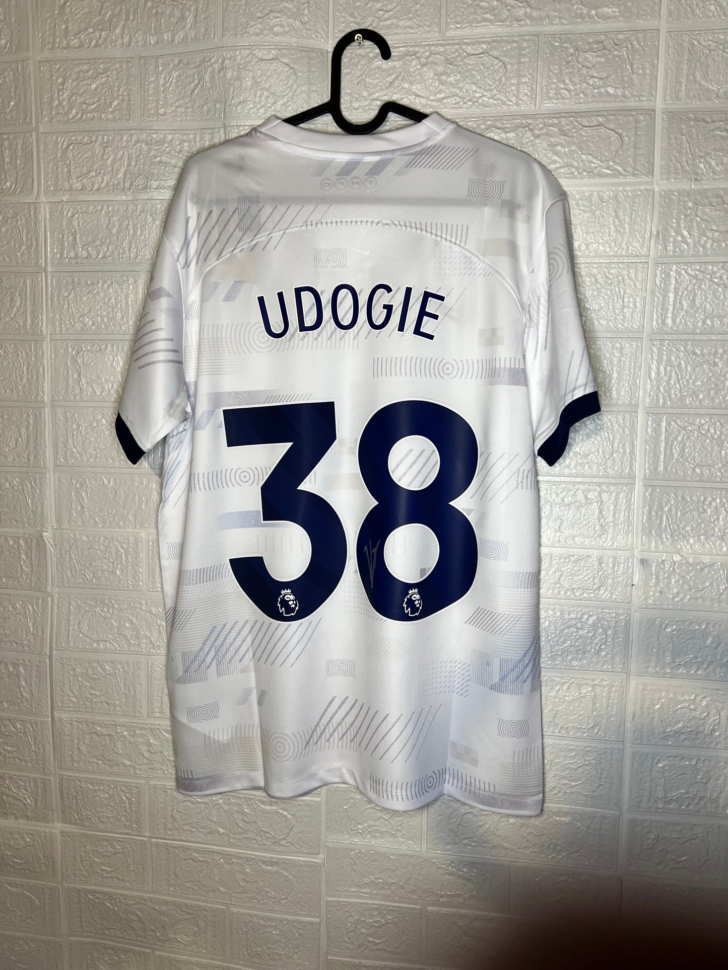 Udogie signed Tottenham shirt.