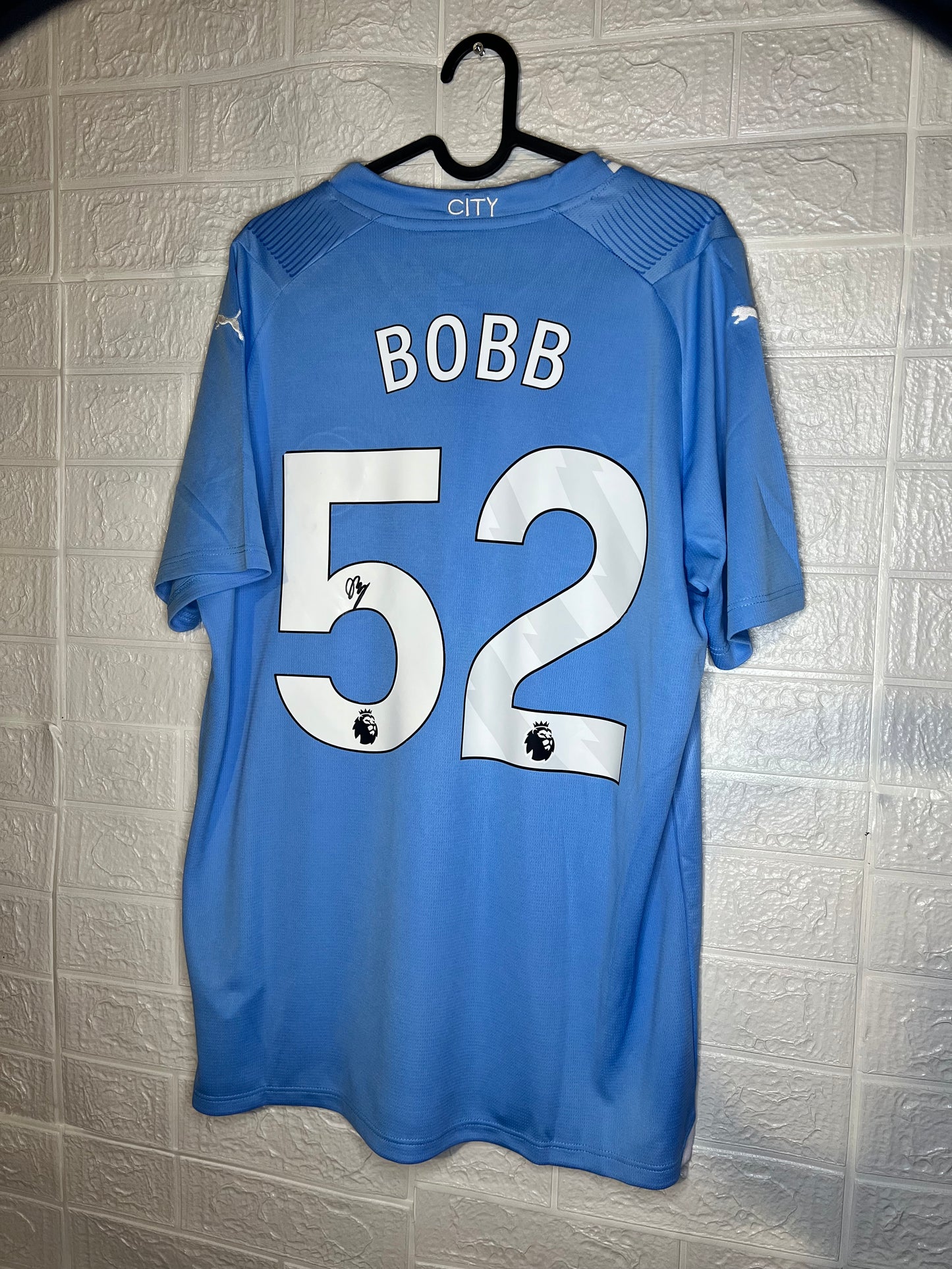 Oscar Bobb signed Manchester City shirt